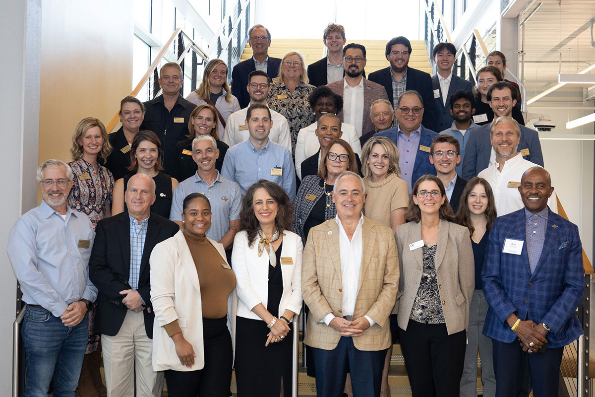 The Georgia Tech President standin with ISyE leasders and the ISyE Advisory Board