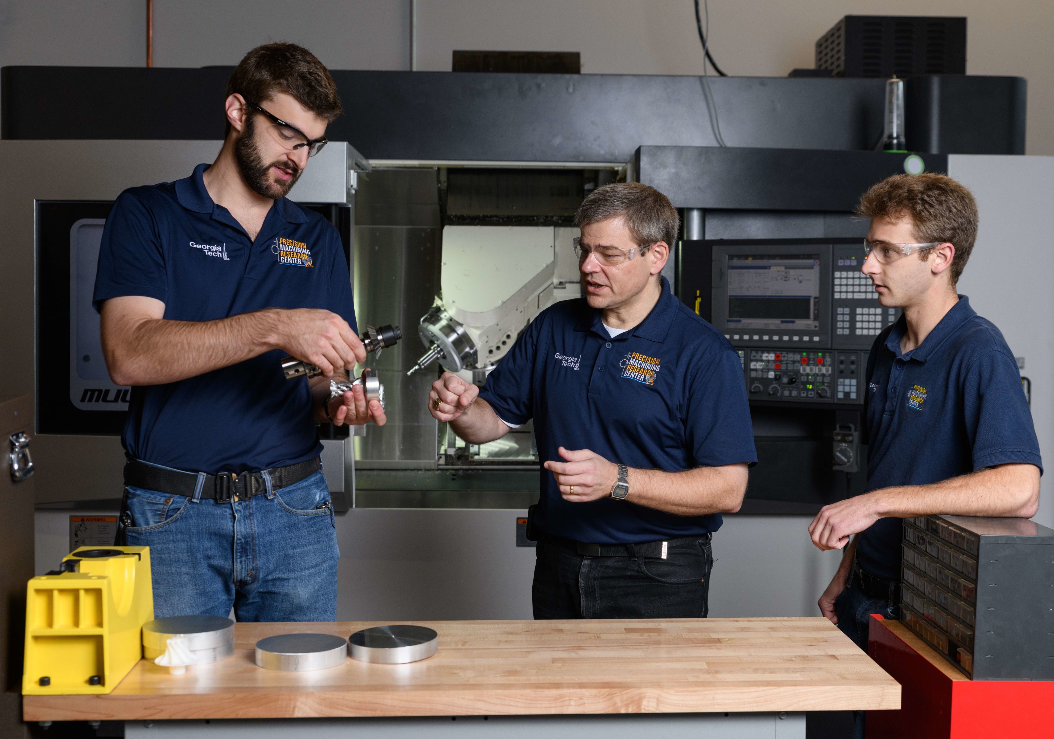 Students with teacher working in a lab