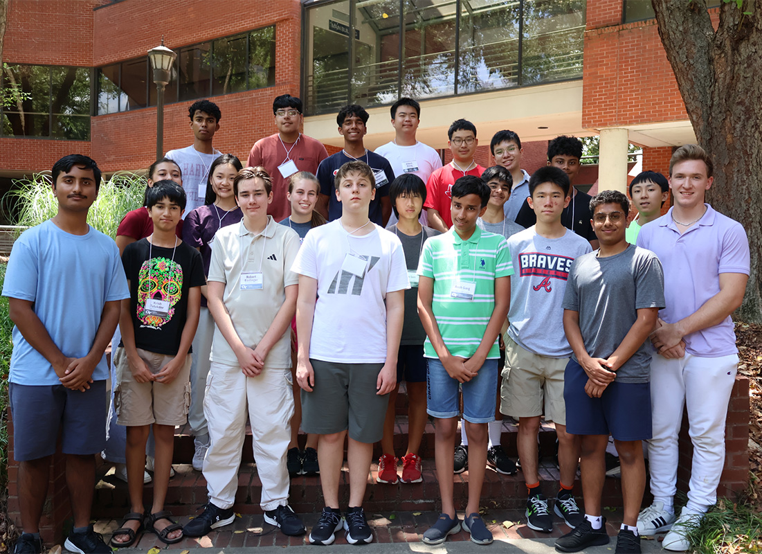 Students standing for a group photot in the ISyE courtyard
