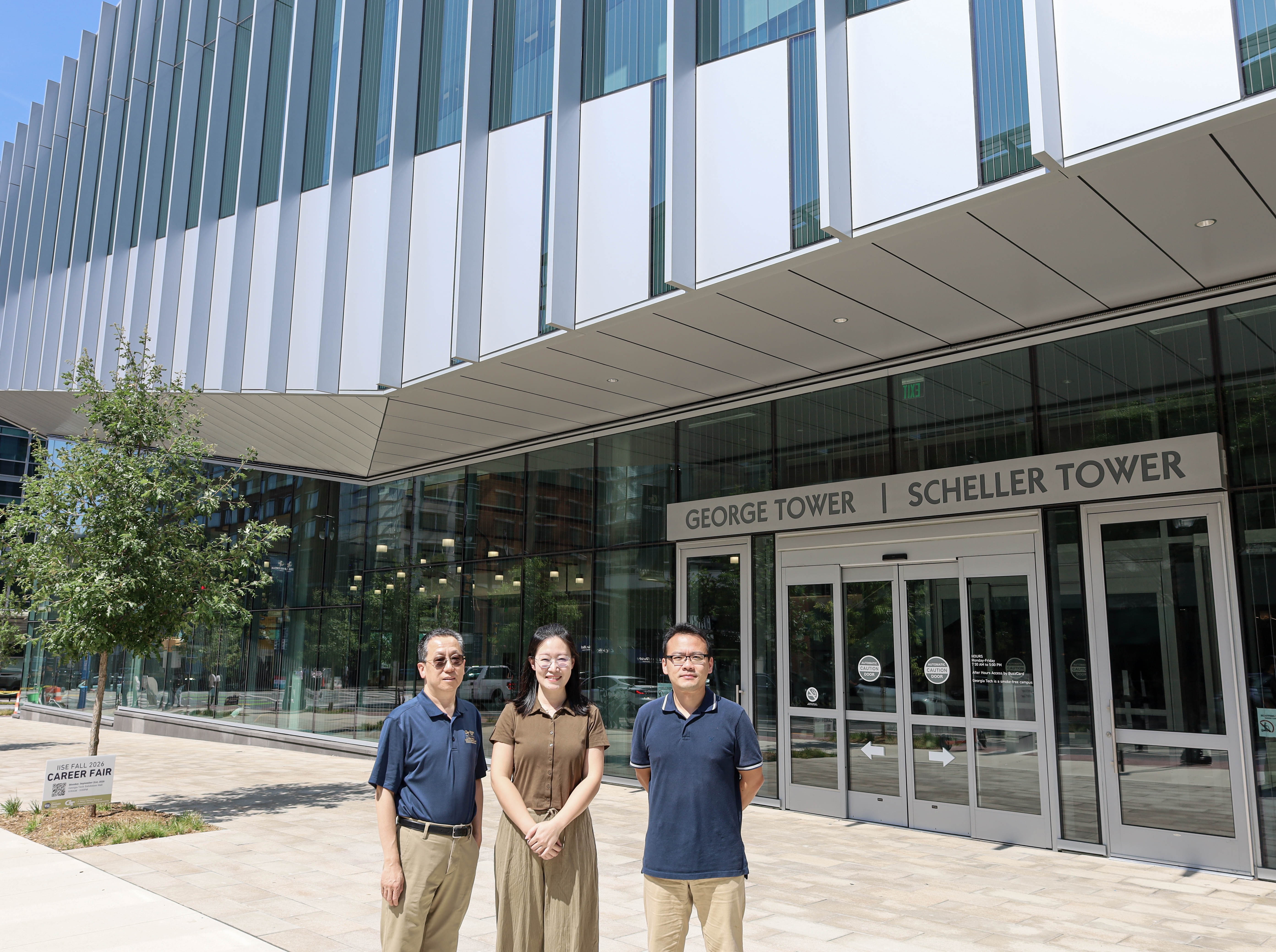 The research team stands outside of George Tower, ISyE's new home in Tech Square.