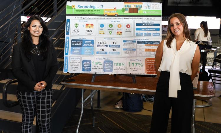 Students in front of a project poster