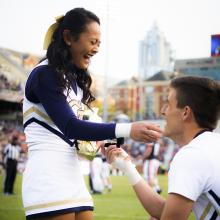 ISyE undergrad Wilson Harmond proposes to his girlfriend, Dana Francisco (ChBE), on Senior Day at the football game against Virginia. The couple are both Georgia Tech cheerleaders.